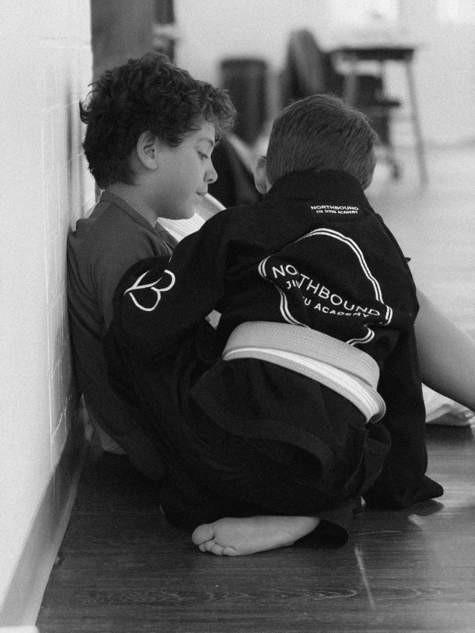Kids training at Northbound Jiu-Jitsu in black and white